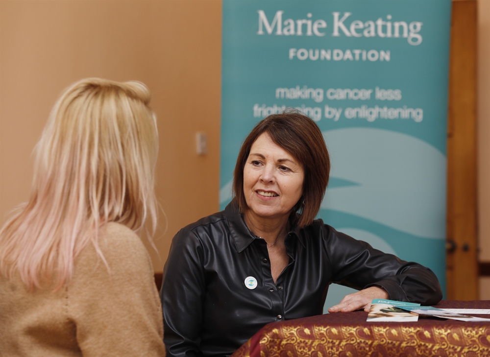 nurse having a conversation with a woman nurse having a conversation with a woman